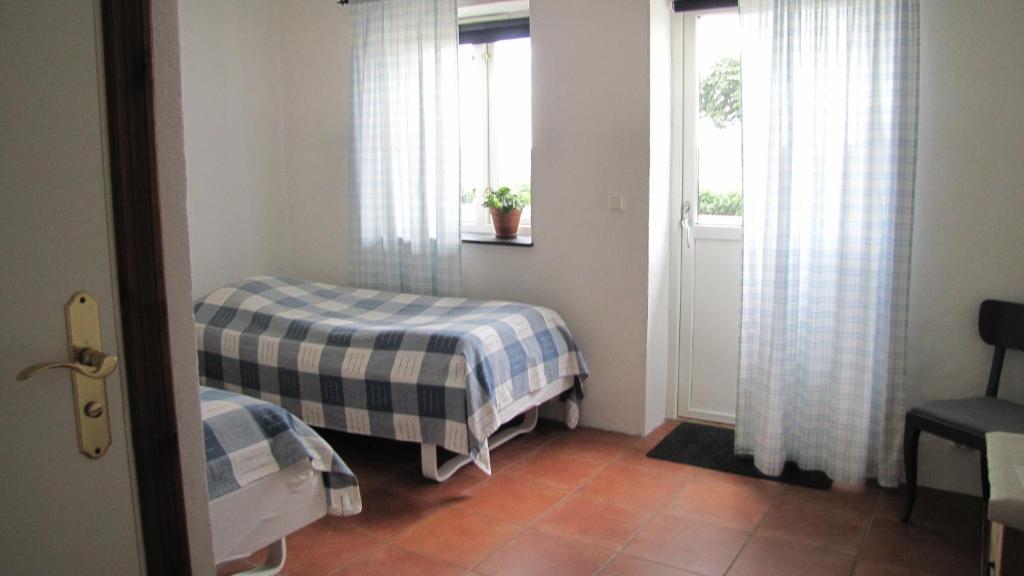Postel nebo postele na pokoji v ubytování Skönadal B&B
