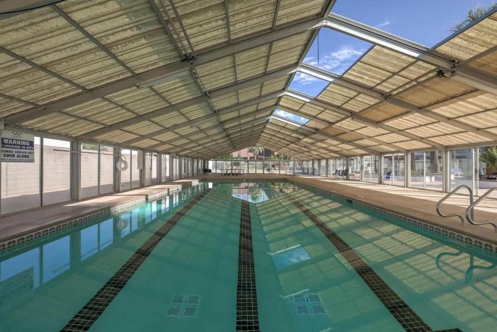 a large swimming pool with a large ceiling at 19-20| 2 Homes in St. George Green Valley with Community Pool in St. George