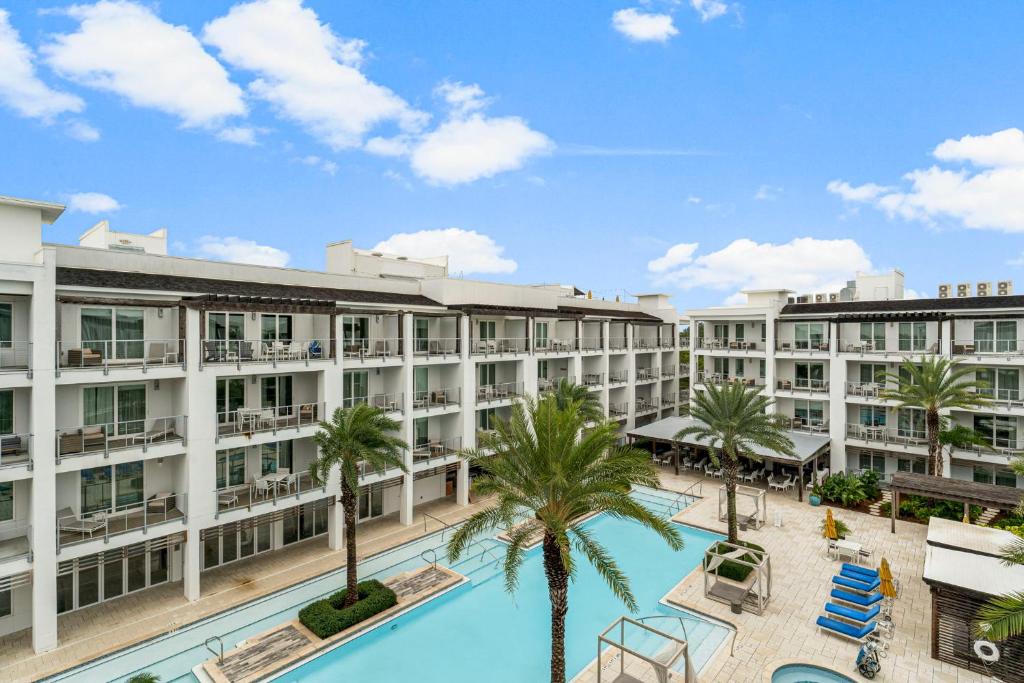an aerial view of the resort with a pool and palm trees at The Pointe Unit 342 by 30A Escapes in Rosemary Beach