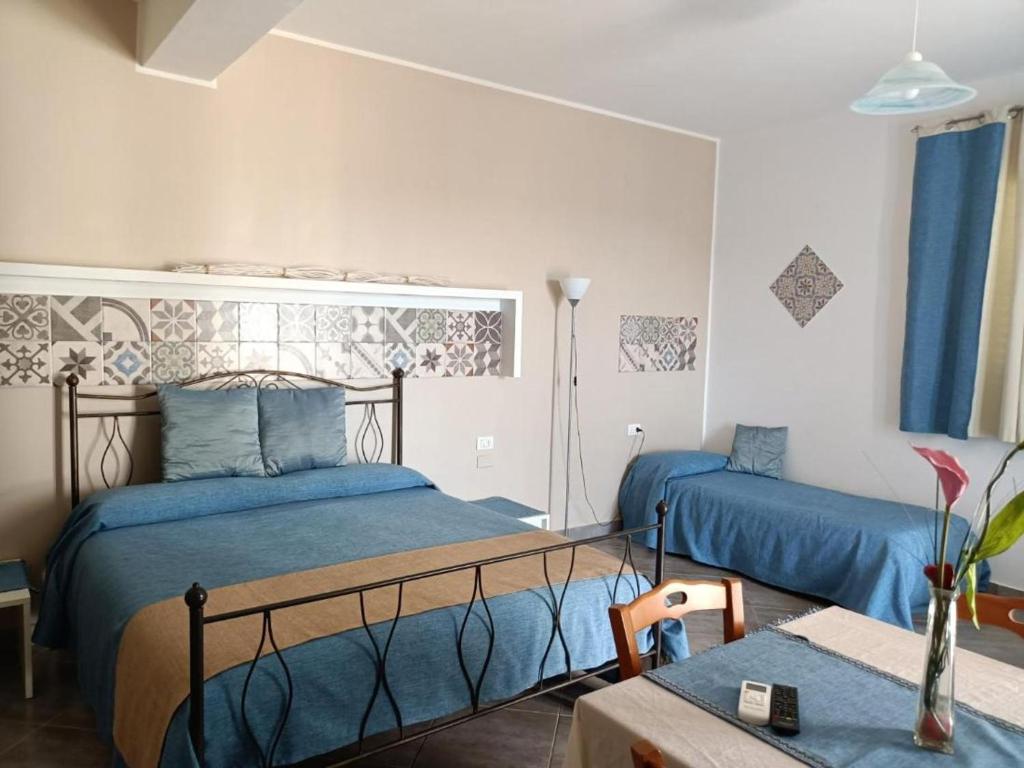 Postel nebo postele na pokoji v ubytování Signorino Eco Resort Family Studio M4