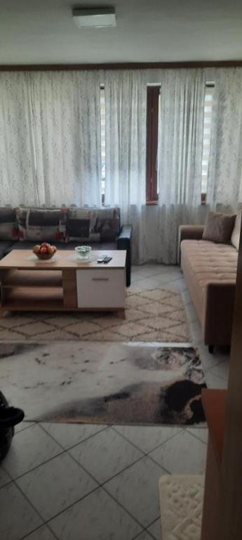 a living room with a couch and a coffee table at Studio apartman City Centre Rogatica in Rogatica