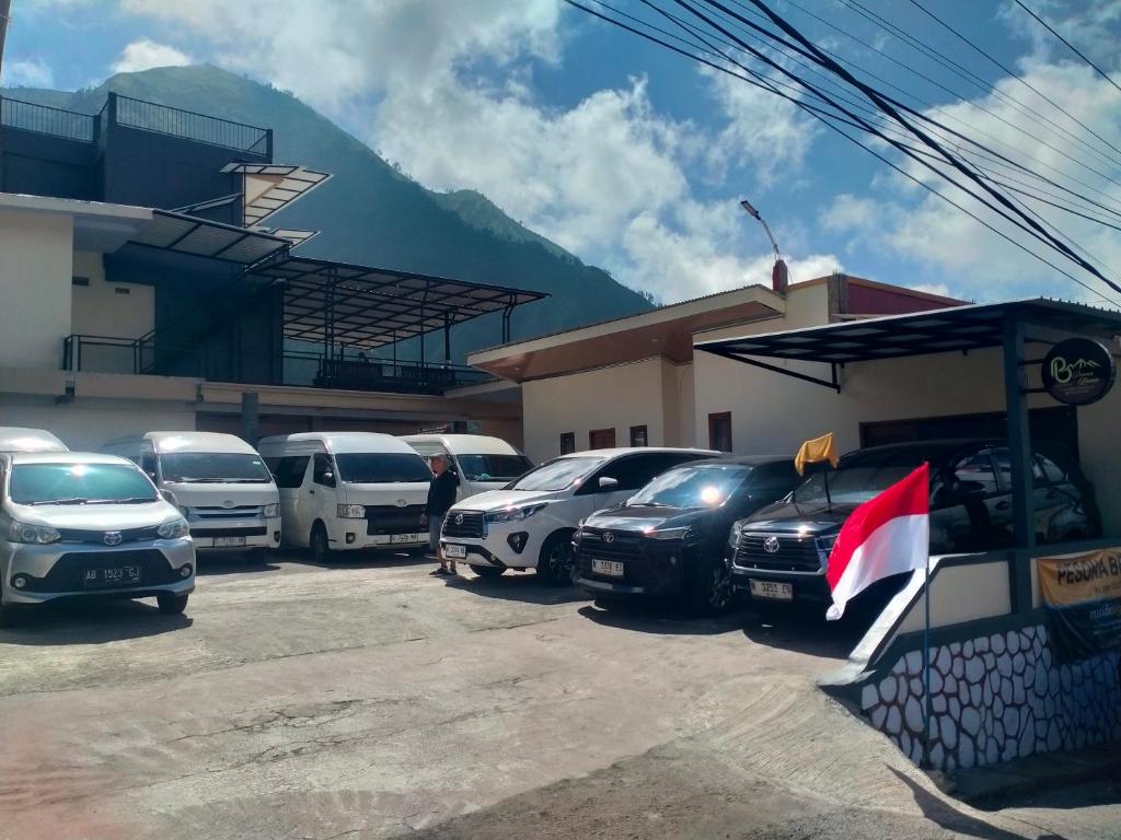 a group of cars parked in a parking lot at PESONA BROMO Homestay in Probolinggo