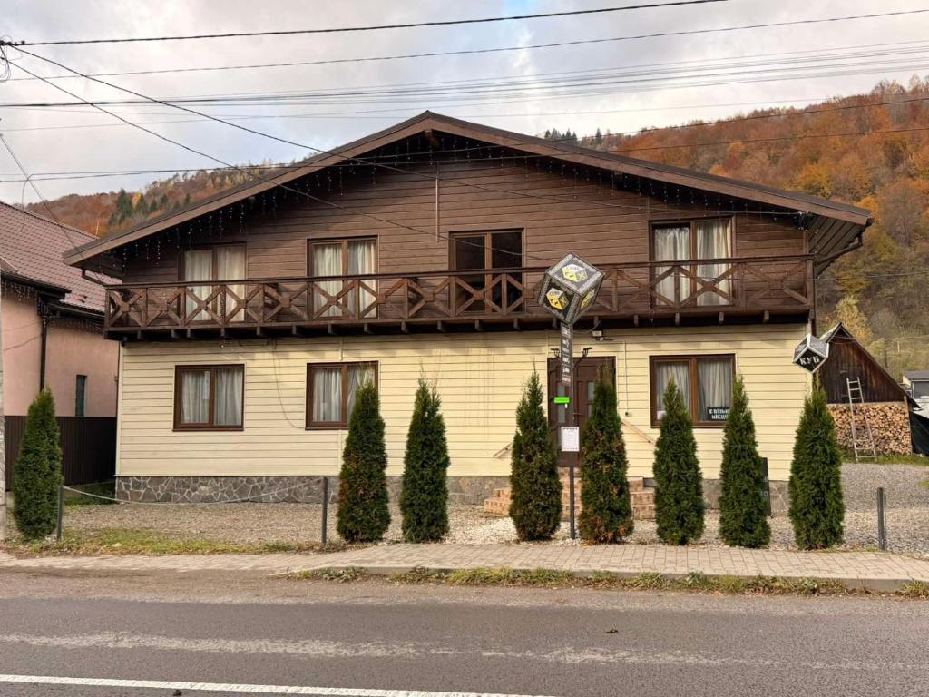 a house with a balcony on the side of it at Cube in Kvasy