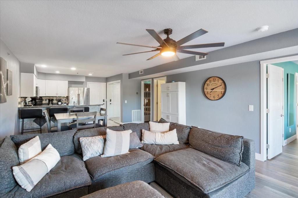 a living room with a couch and a ceiling fan at Lakeview Condo w/ 2 Pools & Beach - Family Fun Awaits at 21MM in Laguna Beach