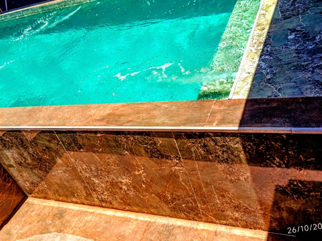 a close up of a pool of water at PANORÂMIC LUXO EXCLUSIVe in Santa Cruz Cabrália
