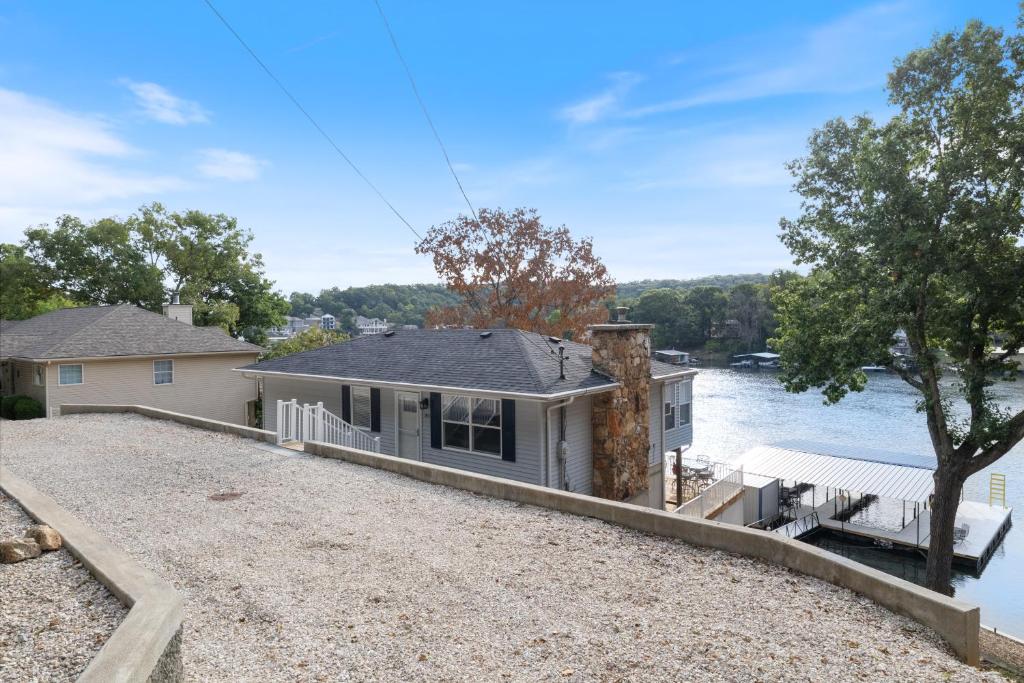 a home on the water with a dock at Pet-Friendly Home, Great Dock, Waterfront, Lake Views, Boat Slip in Damsel