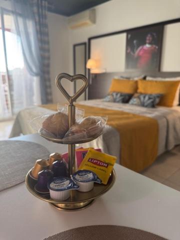 a tray of food on a table in a bedroom at Cozy Studio in Cannes in Le Cannet