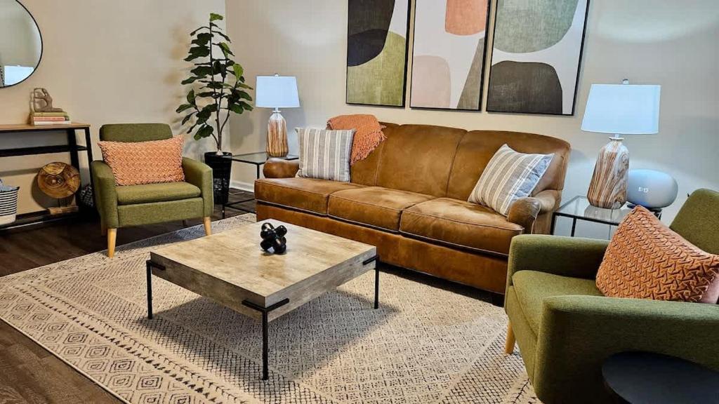 a living room with a couch and two chairs at 5 Minutes to VSU- Sleeps 5 King Bed 2 baths in Valdosta