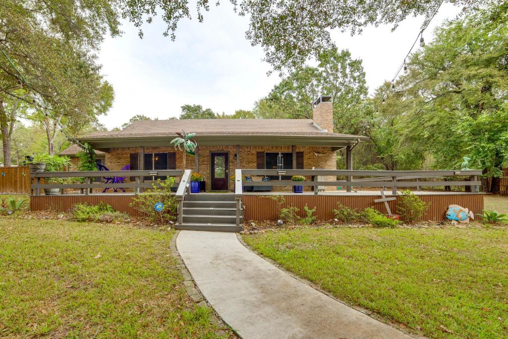 a small house with a fence and a sidewalk at Walk to Lake Athens! Updated Home with Large Deck in Murchison