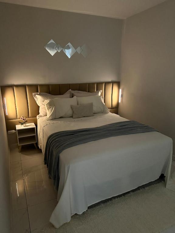 Postel nebo postele na pokoji v ubytování Cocal House Temporada - 1 km da praia