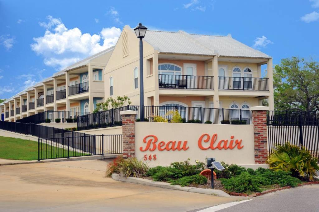 a building with a sign that reads beek clark at 146 Beau Clair - Beachside Townhome with Pool in Long Beach in Long Beach