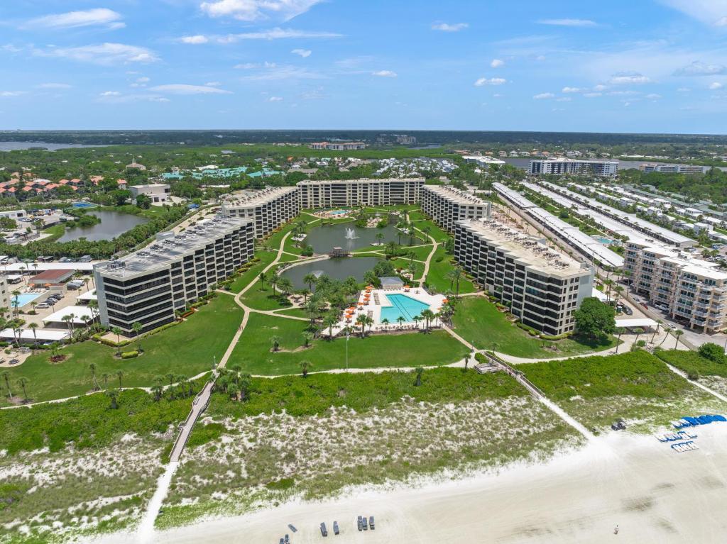 an aerial view of a resort on the beach at Gulf and Bay Club- F401 in Siesta Key