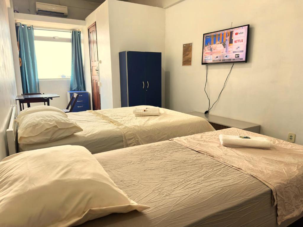 Postel nebo postele na pokoji v ubytování Studio Breezi - São Francisco