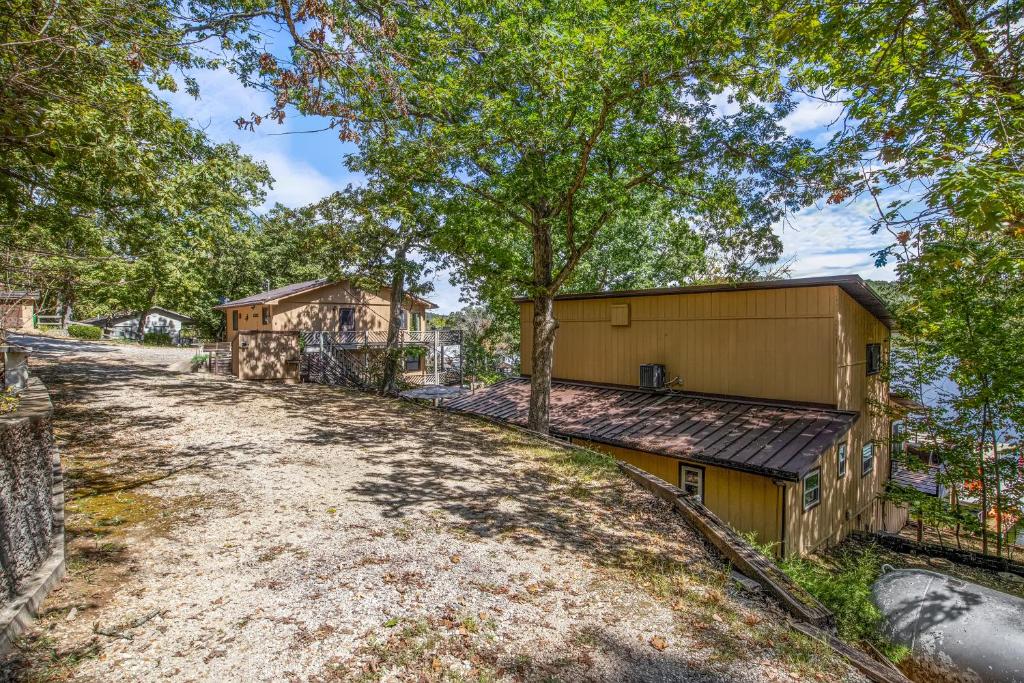 an empty road in front of a house at Spacious, Quiet & Great Cove, Nearby Attractions, Private Dock, Fireplace, Expansive Deck in Rocky Mount