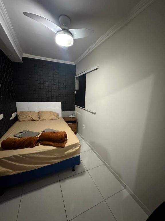 Ένα ή περισσότερα κρεβάτια σε δωμάτιο στο Hospedagem do Centro