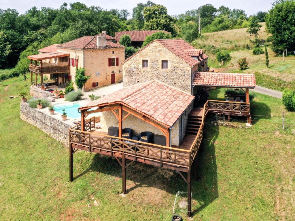 an aerial view of a house with a large deck at Mas dAmour in Montcabrier