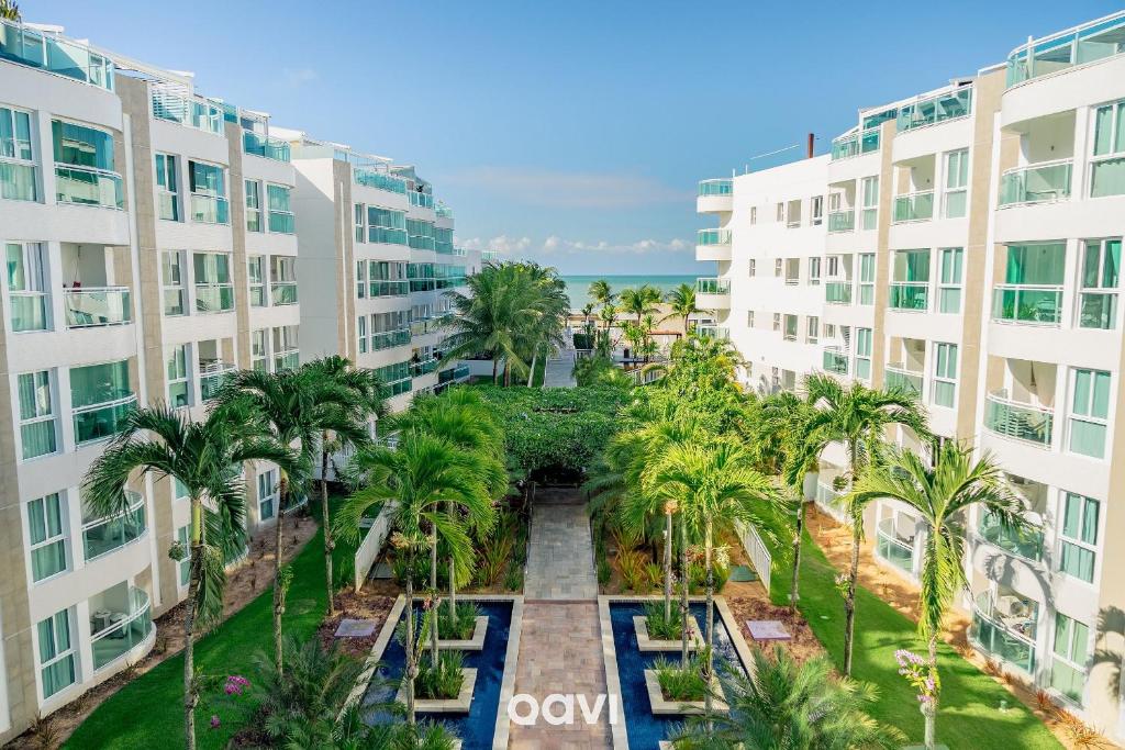 an aerial view of the courtyard of an apartment building at In Mare Bali Flat Premium Sardenha by Qavi in Granja Beira Mar