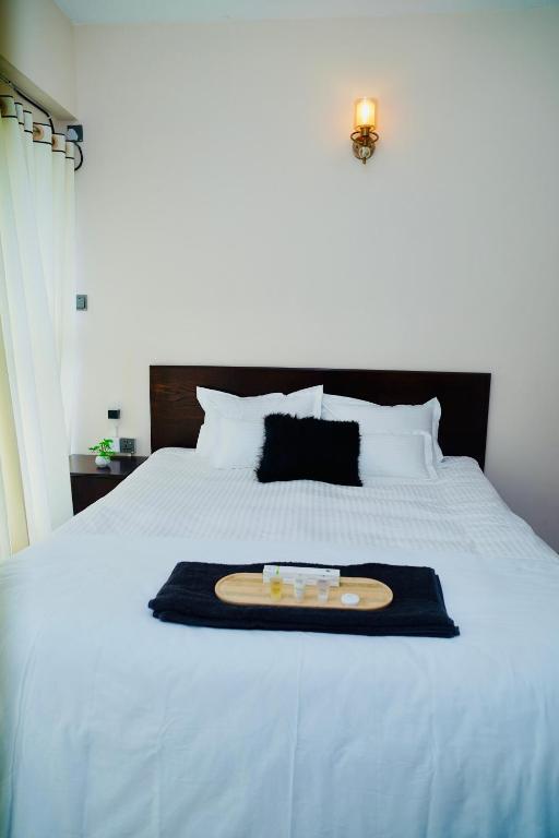 Katil atau katil-katil dalam bilik di Hola Properties