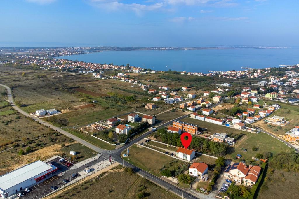 an aerial view of a city and the water at Apartments with parking space Vrsi, Zadar - 15944 in Vrsi