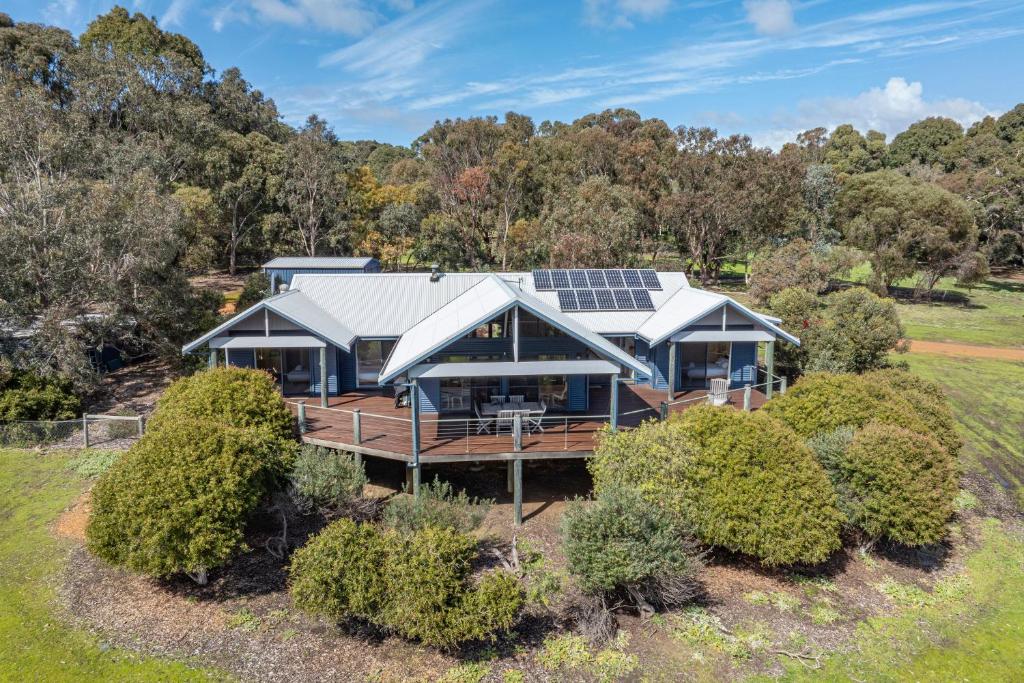 an aerial view of a house with solar panels on the roof at Yallingup Valley Views in Yallingup