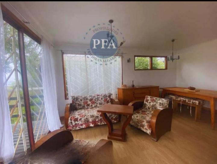 a living room with a couch and a table at Casa Lafken in Mirasol
