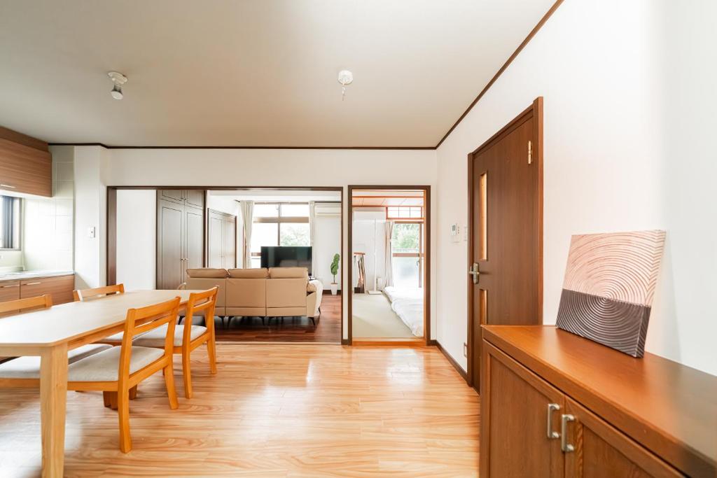 a kitchen and dining room with a table and chairs at Luce Ikebukuro - Cozy APT Stay in Ikebukuro Tokyo, with Direct Access to Shinjuku & Shibuya in Tokyo