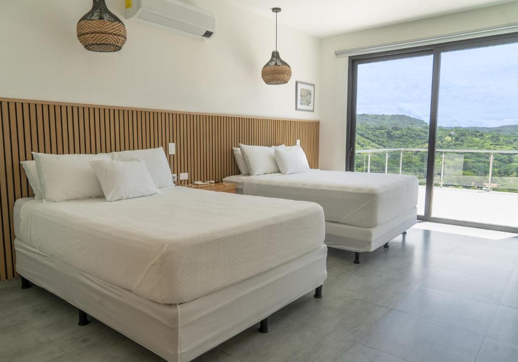 Postel nebo postele na pokoji v ubytování Luxery home in surf city el Sunzal