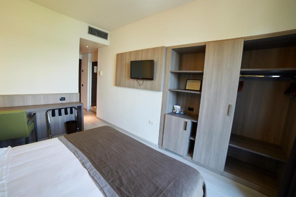 Una cama o camas en una habitación de Hotel Giardino
