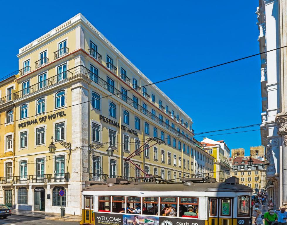 a tram in front of a large building at Pestana CR7 Lisboa in Lisbon