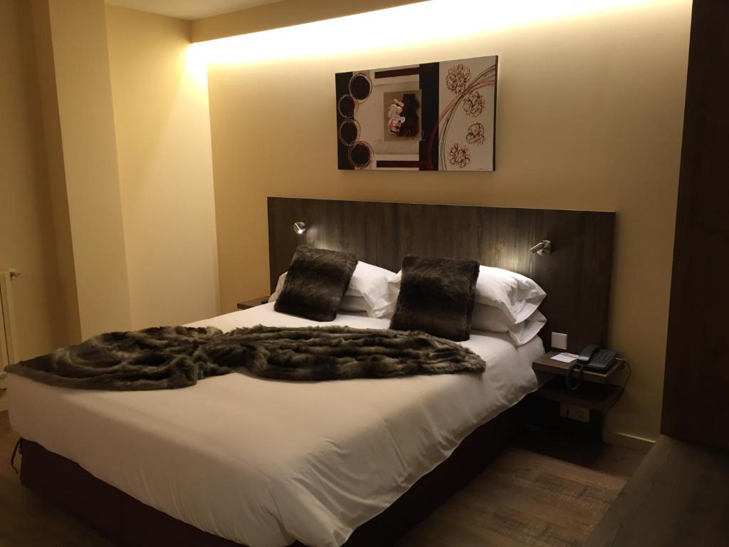Postel nebo postele na pokoji v ubytování Hotel L’Ermita B&B