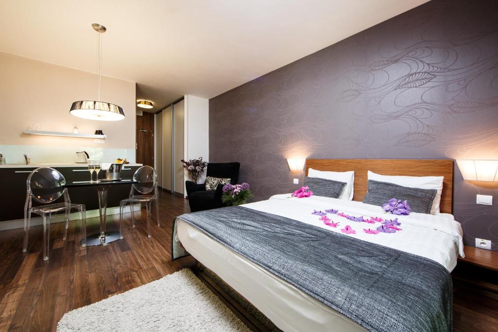 Postel nebo postele na pokoji v ubytování Hotel FIS Jasná