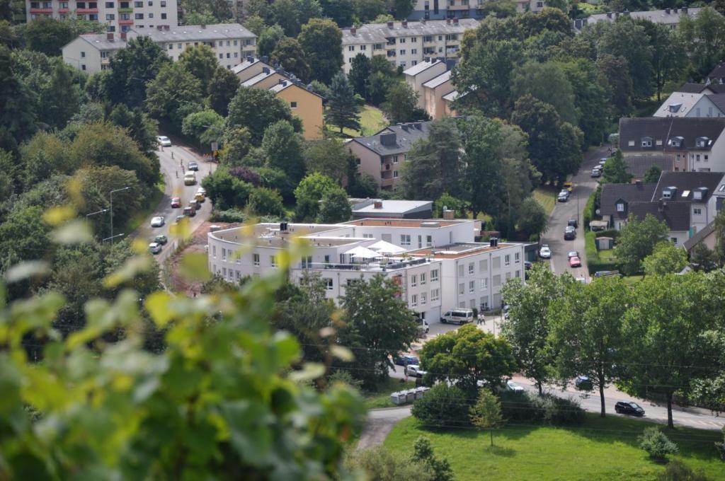 a view of a city with cars driving down a street at Schroeders Wein-Style-Hotel in Trier