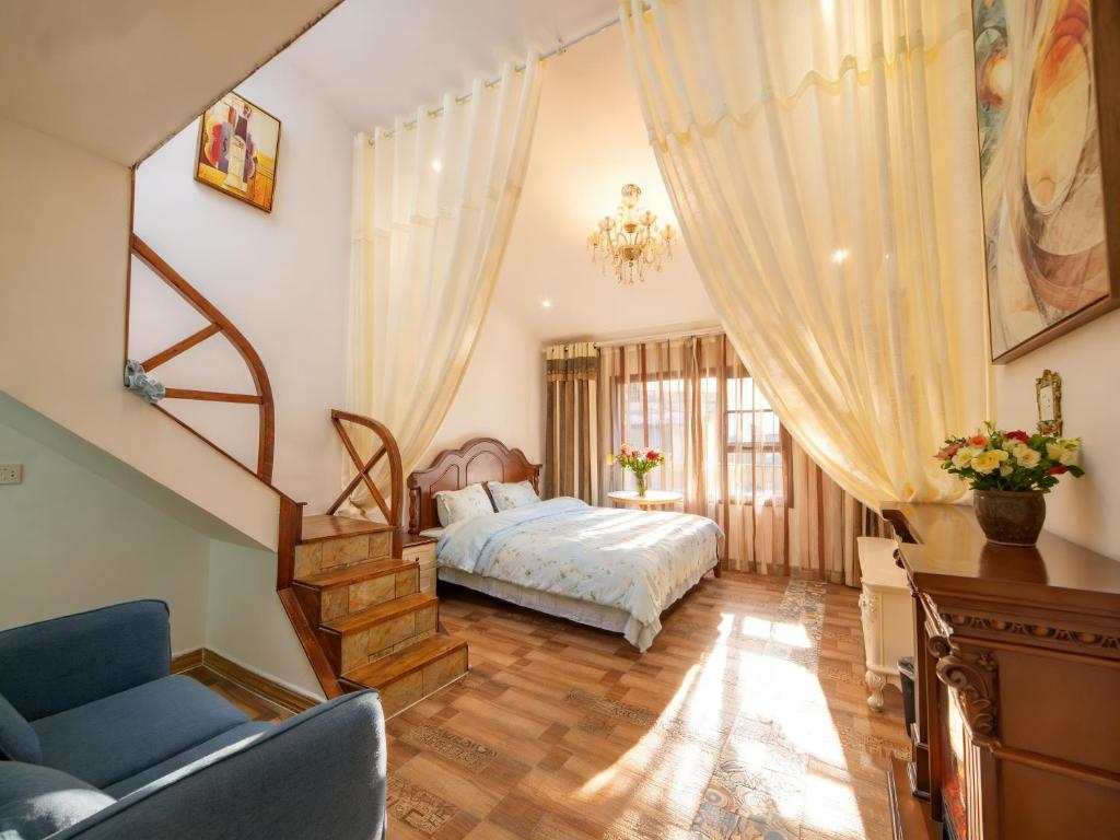 a bedroom with a bed and a stair case at Zhangjiajie Han Exotic Inn in Zhangjiajie