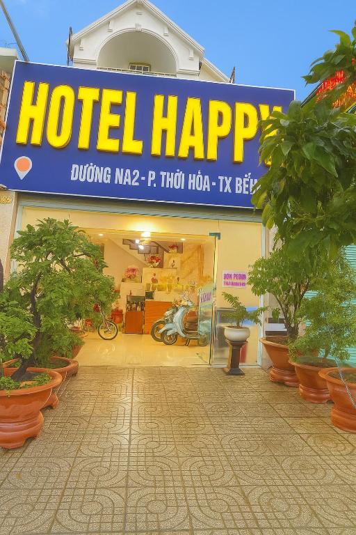 a hotel happy sign in front of a store at Happy 1 Hotel Binh Duong in Bến Cát