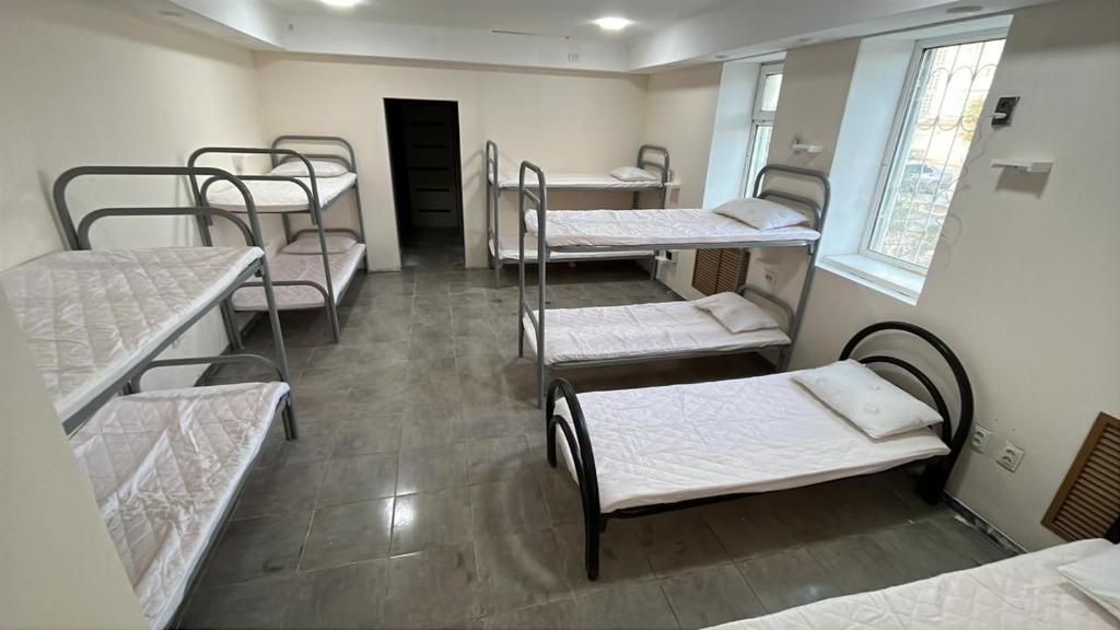 a room with a bunch of bunk beds at Lighthouse in Aktau