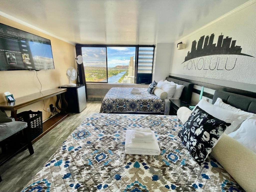 En eller flere senge i et værelse på *RareLayout*2Qn Beds*Great for Groups,Friends,Wakiki