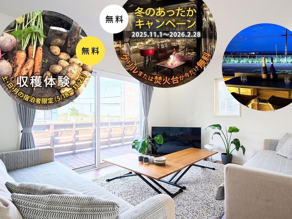 a living room with a couch and a table at 九十九里SURFテラス‹SORA›-寛道- in Ichinomiya