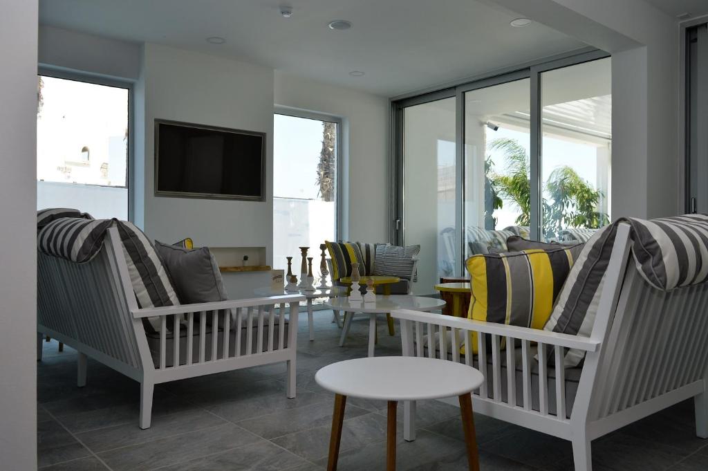 Uma TV ou centro de entretenimento em Island Boutique Hotel