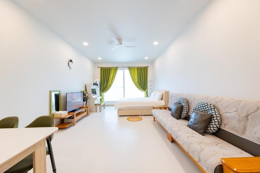 a living room with a couch and a tv at Gapyeong Ttongkkodeuruisuda Pension in Gapyeong
