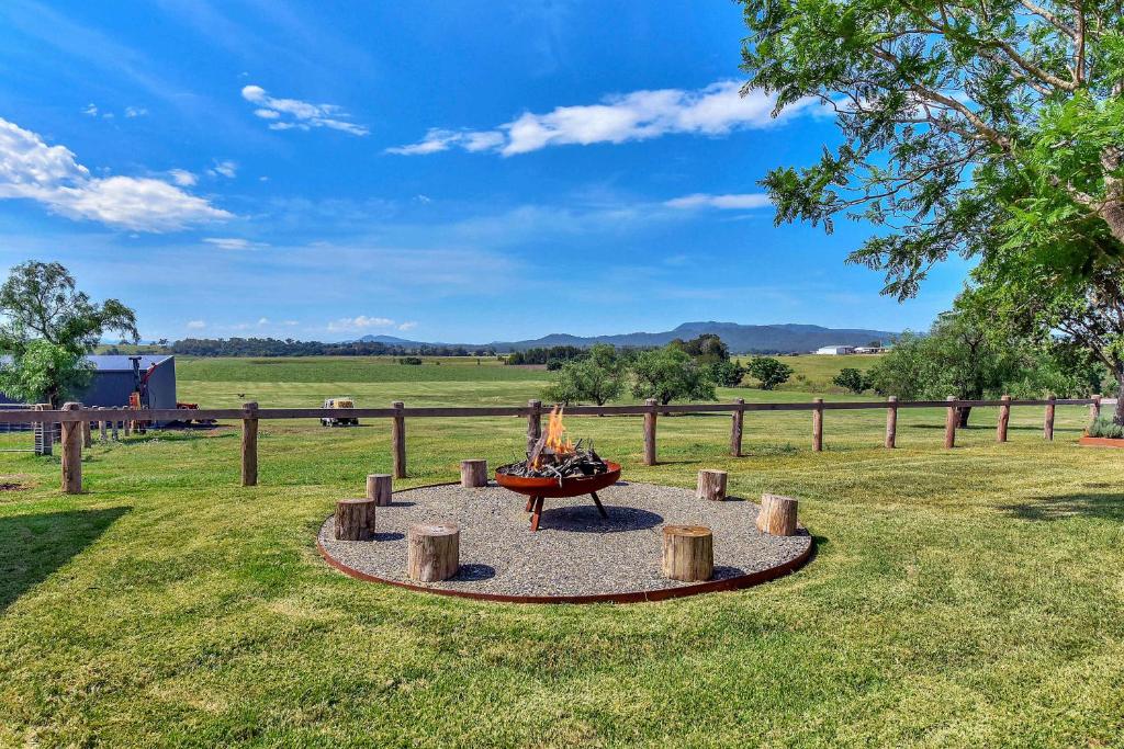 a fire pit in the middle of a field at Stellaview Estate in Mitchells Flat