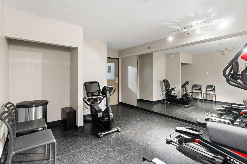 a gym with several exercise equipment in a room at Country Inn & Suites by Radisson, Saskatoon, SK in Saskatoon