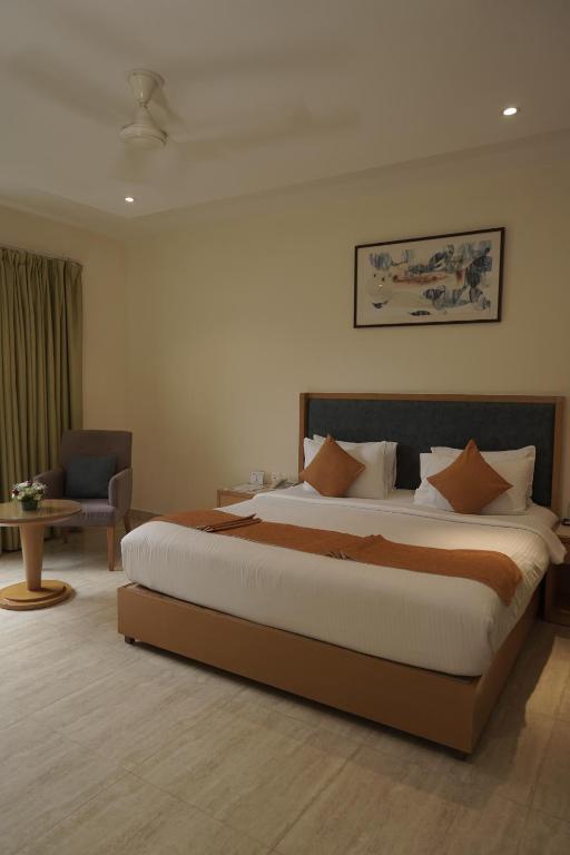 a bedroom with a large bed in a room at Trevon Hotels & Resorts Goa in Goa Velha