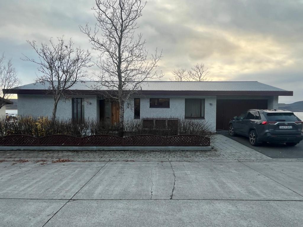 a car parked in front of a house at Sigtún 4 in Patreksfjörður