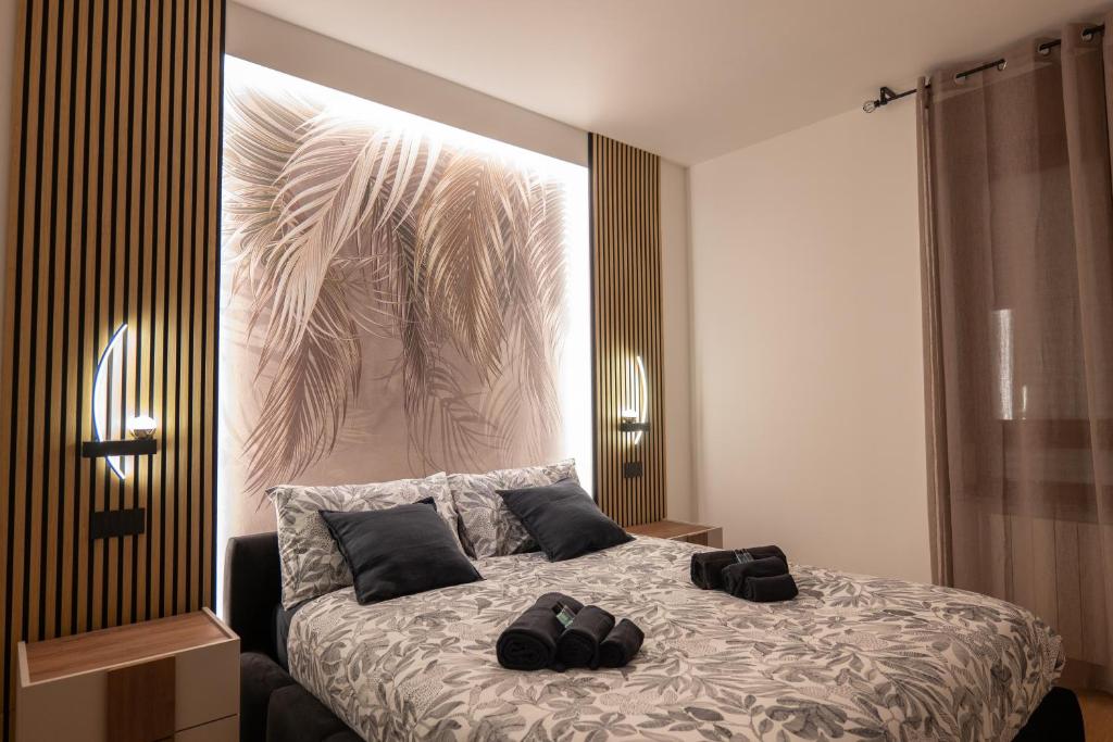 Ένα ή περισσότερα κρεβάτια σε δωμάτιο στο Elegant Urban Home - Free Parking - 7min Niguarda