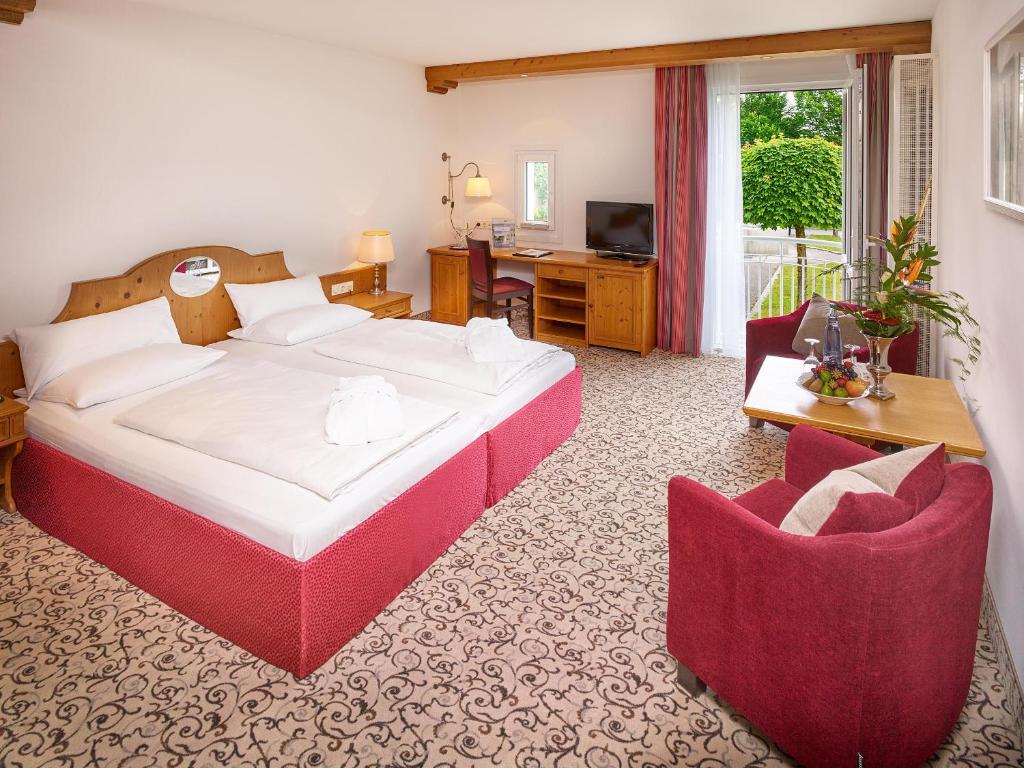 Postel nebo postele na pokoji v ubytování Hotel Maximilian