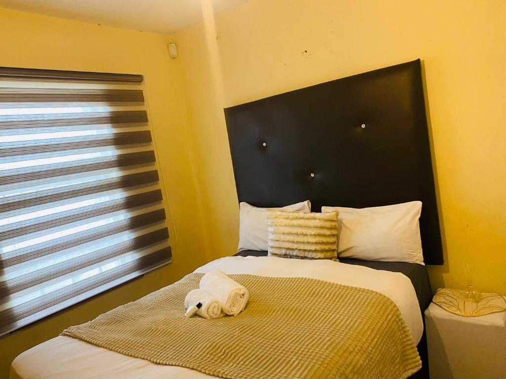 Ένα ή περισσότερα κρεβάτια σε δωμάτιο στο S Heavenly