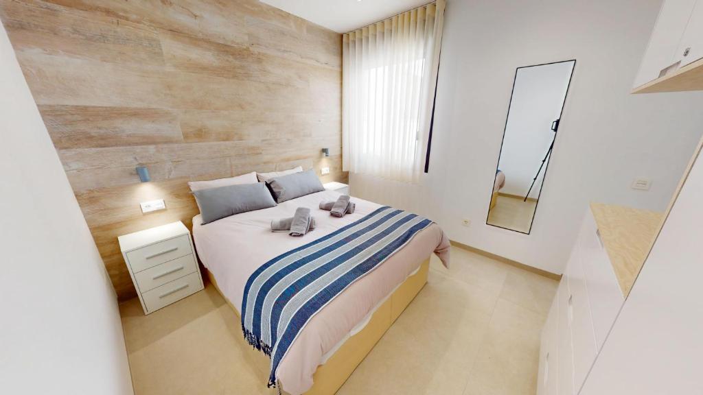 En eller flere senge i et værelse på Holidoo Travel - Casa Cielo Azul