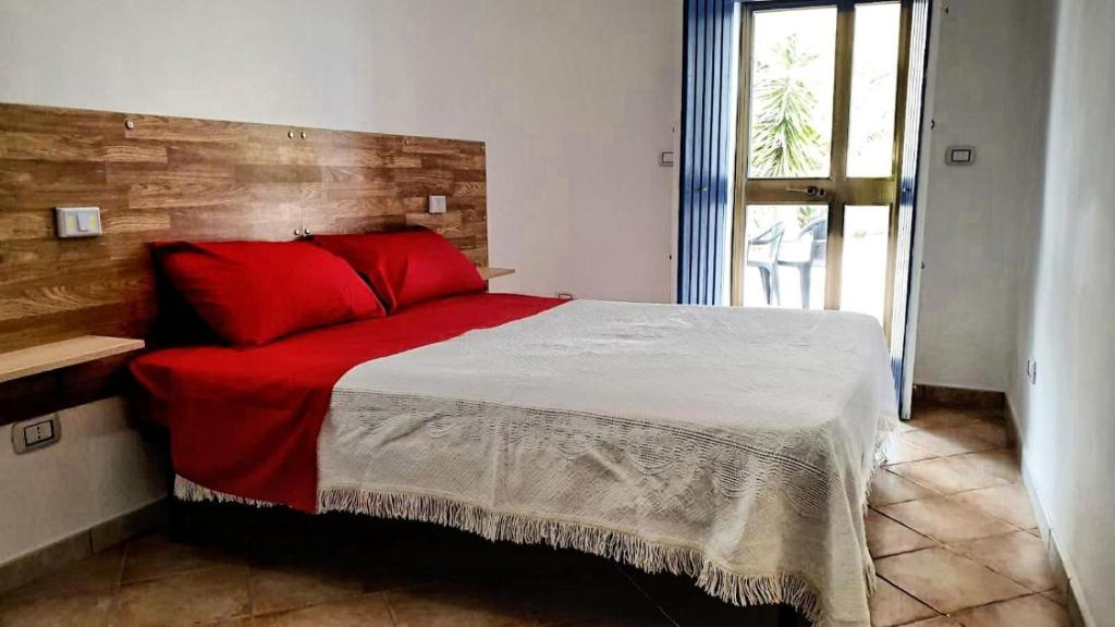 Ένα ή περισσότερα κρεβάτια σε δωμάτιο στο Trullallegro