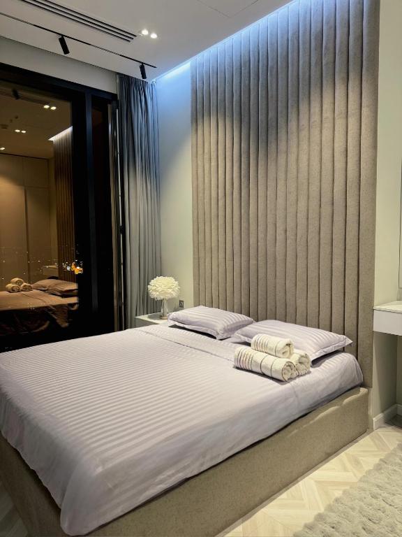 Ένα ή περισσότερα κρεβάτια σε δωμάτιο στο Cozy Nest Apartments