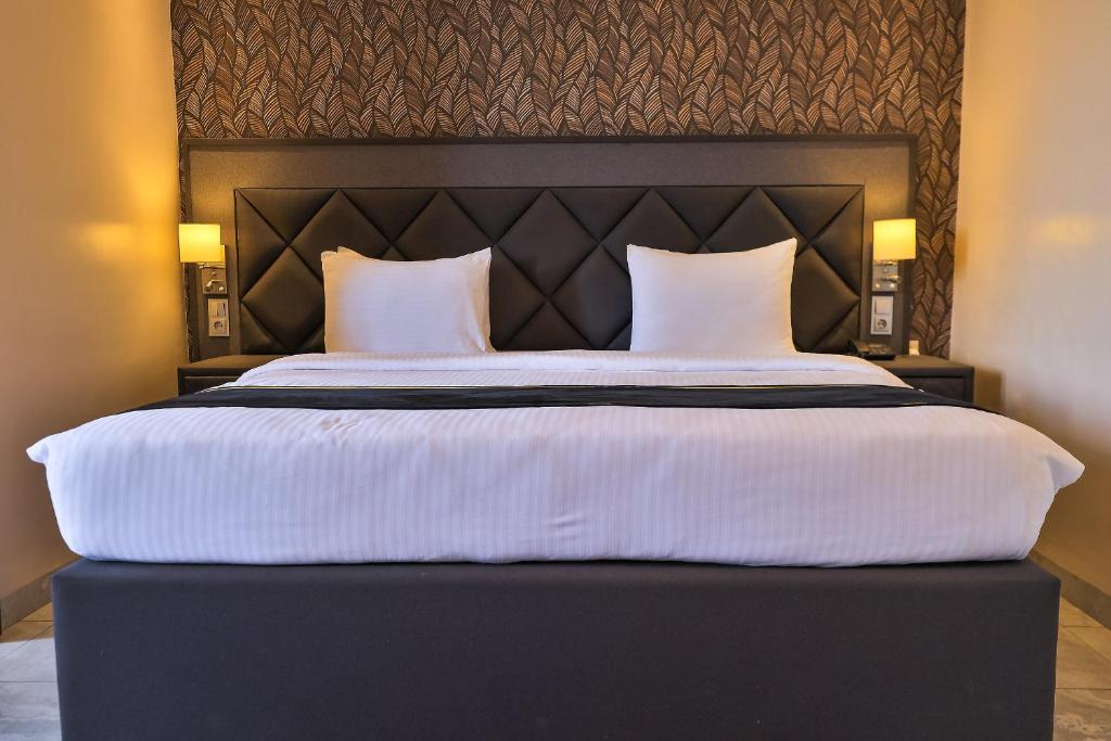 Ένα ή περισσότερα κρεβάτια σε δωμάτιο στο Homefree Hotel by signature